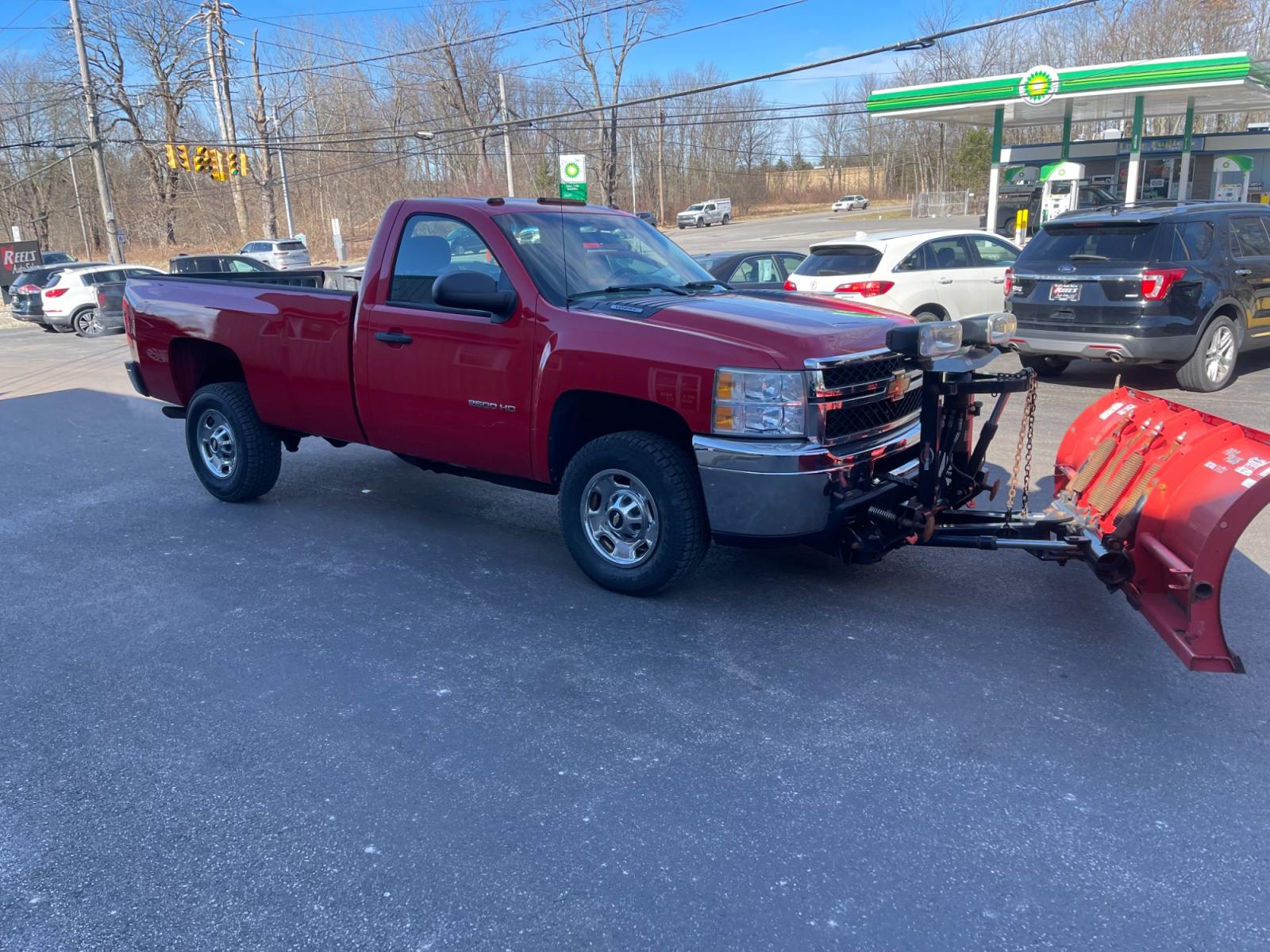 2011 Red /Black Chevrolet Silverado 2500HD Work Truck Long Box 4WD (1GC0KVCG8BF) with an 6.0L V8 OHV 16V FFV engine, 6-Speed Automatic transmission, located at 11115 Chardon Rd. , Chardon, OH, 44024, (440) 214-9705, 41.580246, -81.241943 - This 2011 Chevrolet Silverado 2500 Work Truck with a Regular Cab featuring a 6.0L Vortec V8 and a 6-speed transmission is a robust and versatile pickup designed for heavy-duty tasks. Its significant powertrain is well-suited for towing and hauling heavy loads, making it an ideal choice for work in c - Photo #4